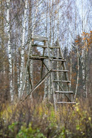 Photo for Wooden hunting watch tower in late autumn fields empty - Royalty Free Image