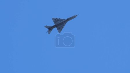 Photo for Pula Croatia March 23 2024: A mig-21 fishbed jet from the croatian air force soaring in a clear blue sky, with copy space - Royalty Free Image