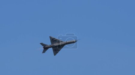 Photo for Pula Croatia March 23 2024: Mig-21 fishbed jet from the croatian air force soars in a clear blue sky, offering ample copy space - Royalty Free Image