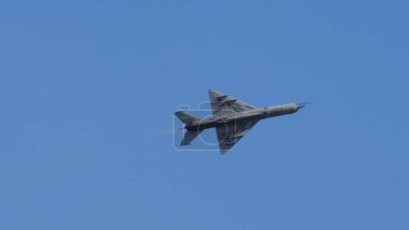 Photo for Pula Croatia March 23 2024: Mig-21 fishbed, the iconic fighter jet, soaring in the sky, belonging to the croatian air force, with ample copy space - Royalty Free Image