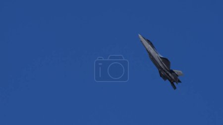 Photo for Athens Greece September 3 2023: Modern USAF Fighter Jet Climbing in Blue Sky with Afterburner. Lockheed Martin F-35 Lightning II of United States Air Force. Copy Space - Royalty Free Image
