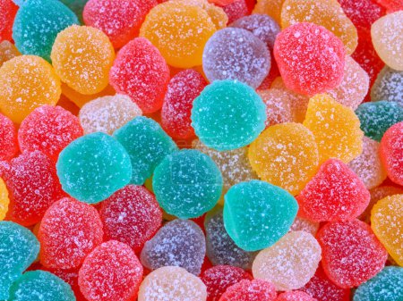 multicolored jelly candies on white background.