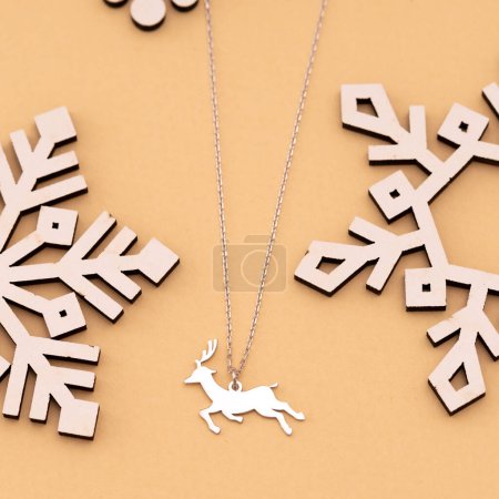 Christmas concept product image on a cream background. Photography in jewelry and new year concept.