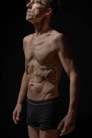 Foto de Still life. Studio shot of a mature man posing shirtless - Imagen libre de derechos