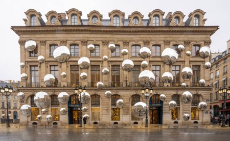 Photo for Place vendome. View of the facade of Louis Vuitton with lots of mirrors reflecting the buildings around - Royalty Free Image