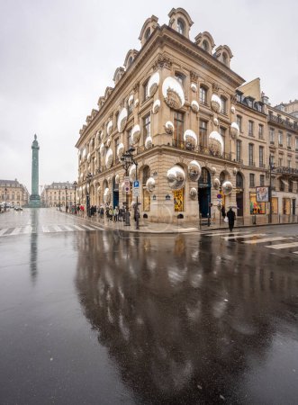 Photo for Place vendome. View of the facade of Louis Vuitton with lots of mirrors reflecting the buildings around - Royalty Free Image