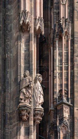 Photo for Strasbourg, France - 06 26 2023: Strasbourg cathedral: Detail of the walls on the roof of the cathedral with statues - Royalty Free Image