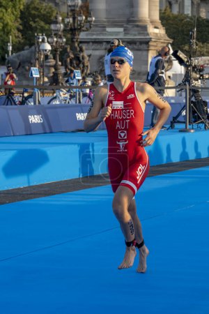 Photo for Paris, France - 08 17 2023: Paris 2024 triathlon test event. Parade of female triathletes at the start of the race from the Alexandre III bridge - Royalty Free Image