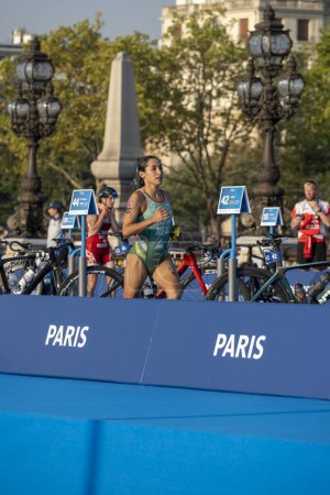 Photo for Paris, France - 08 17 2023: Paris 2024 triathlon test event. Women triathletes at the start of the cycling race just after the swimming race on the Alexandre II bridge - Royalty Free Image