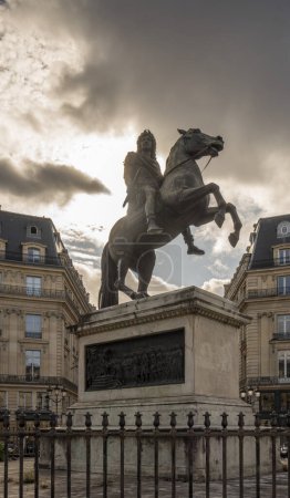 Photo for Paris, France - 08 26 2023: View of the Victories Square and statue of Louis XIV riding a horse in backlight - Royalty Free Image
