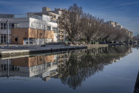 Photo for Paris, France - 01 27 2024: Ourcq Canal. Reflections on the Ourcq canal of buildings and trees - Royalty Free Image