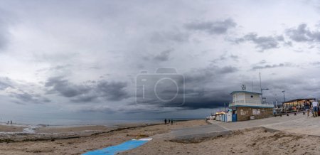 Photo for Langrune Sur Mer, France - 07 28 2023: View of the rescue center from the jetty with a cloudy sky - Royalty Free Image