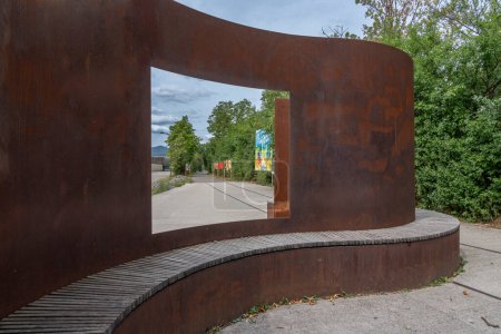 Rosheim, France - 06 27 2023: View of a wooden and steel plate bench along the bike lane