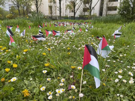 Gennevilliers, France - 04 01 2024: Eco-neighborhood. View of Palestinian flags planted in a park in support of the people of Gaza