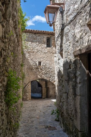 Panoramic View of a typical white Occitan stone passage of the Village on the hill