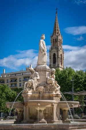 Nîmes, France - 04 17 2024 : Vue de la fontaine du Pradier et de l'église Sainte Perptue derrière