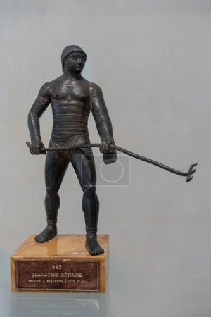 Paris, France - 05 10 2024: Sport in Antiquity. View of bronze statuettes of a Retiarius Gladiator