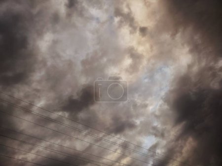 Dramatic Storm Clouds Gathering Over Power Lines - A Perfect Storm Brewing in Natures Sky