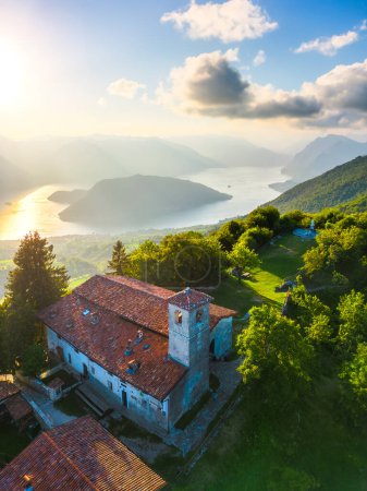 Photo for Vertical aerial view of lake Lago dIseo and Montisola from Santa Maria del Giogo during summer sunset. Sulzano, Iseo, Lombady, Italy - Royalty Free Image