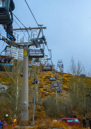 Photo for View of ski lift in Sierra Nevada Capped Mountain. - Royalty Free Image