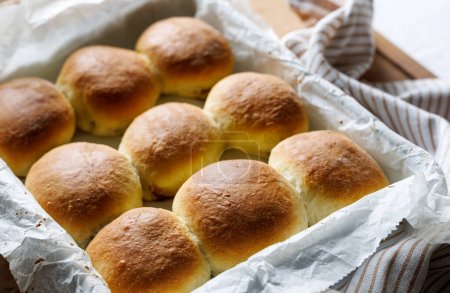 Photo for Homemade yeast dinner rolls stuffed with rose jam, close up view - Royalty Free Image
