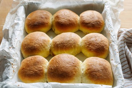 Photo for Homemade buttery yeast rolls stuffed with rose jam, close up view - Royalty Free Image