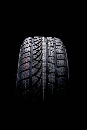 Photo for Winter tire on black background - Royalty Free Image