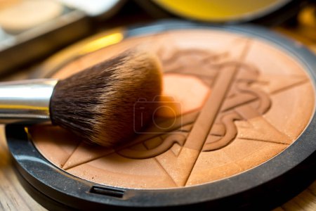 Photo for Makeup brush on a makeup powder - Royalty Free Image