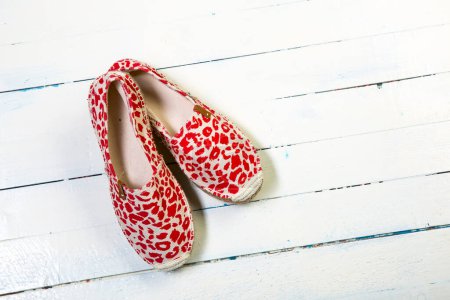 Photo for Red shoes on wooden background - Royalty Free Image