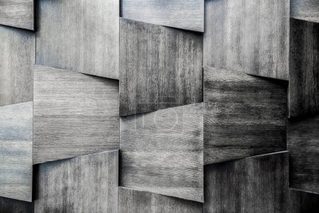 Téléchargez les photos : Mur en bois qui se combine avec de nombreuses tuiles en bois. Fond de texture bois. Photo noir et blanc - en image libre de droit