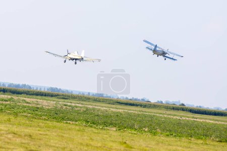 Photo for Military planes flying over ground - Royalty Free Image