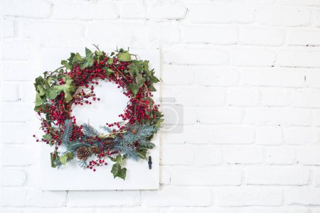 Photo for Christmas wreath with red ribbon decoration isolated on white - Royalty Free Image
