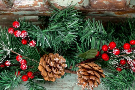 Photo for Christmas background with pine tree, rustic wooden planks and berries. Winter holiday theme. Happy New Year. Space for text. - Royalty Free Image