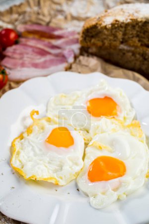 Photo for Smoked ham , rustic bread with bulls-eye eggs - Royalty Free Image