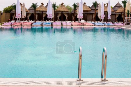 Photo for Swimming pool in touristic resort during summer time - Royalty Free Image