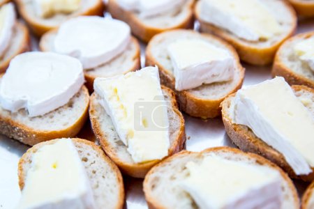 Photo for Brie cheese on bread slices - Royalty Free Image