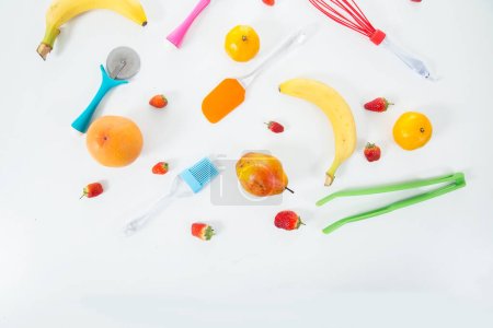 Photo for Set of fruits and colorful kitchenware. Top view - Royalty Free Image