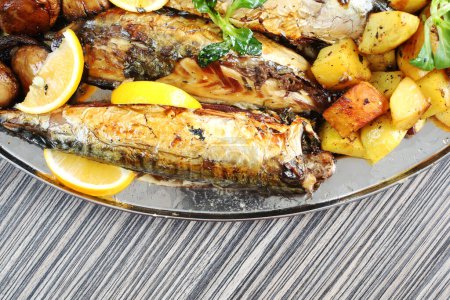 Photo for Grilled mackerel fish with baked potatoes - Royalty Free Image