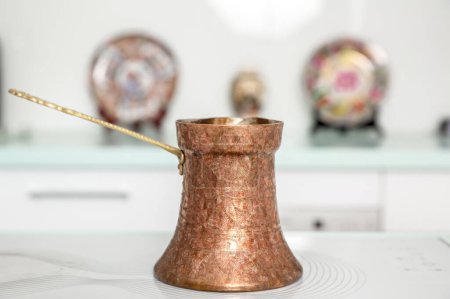 Photo for Old Turkish copper pot for brewing coffee. - Royalty Free Image