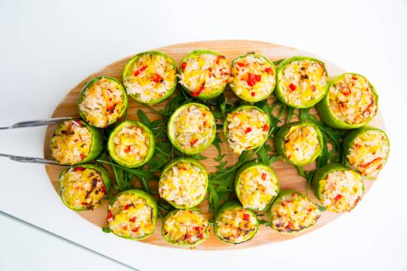 Photo for Zucchini stuffed with rice on wooden tray - Royalty Free Image