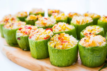 Photo for Zucchini stuffed with rice on wooden tray - Royalty Free Image