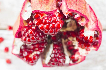 Photo for Fresh pomegranates on wooden table - Royalty Free Image