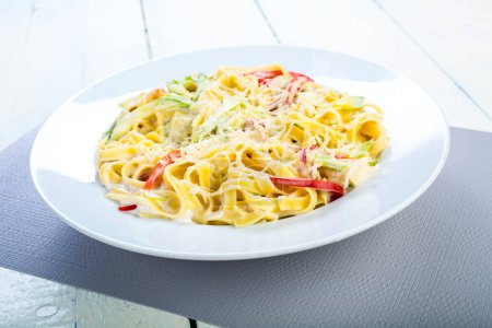 Photo for Pasta tagliatelle with zucchini on plate - Royalty Free Image