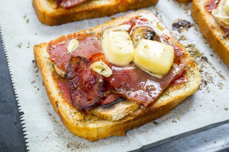 Photo for Grilled bruschetta with prosciutto ham and cheese - Royalty Free Image