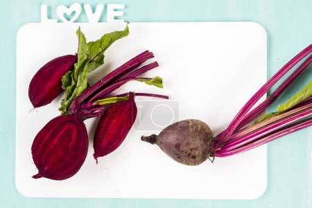 Photo for Beet on a blue wooden. Fresh organic vegetables. Food background. Healthy herbs from garden - Royalty Free Image