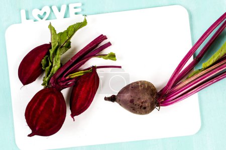 Photo for Beet on a blue wooden. Fresh organic vegetables. Food background. Healthy herbs from garden - Royalty Free Image