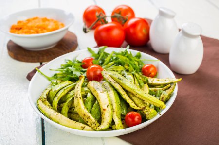 Photo for Zucchini salad with arugula and cherry tomato - Royalty Free Image