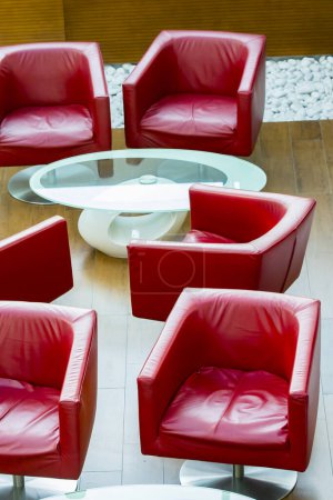 Photo for Fashion red armchairs on a wooden floor - Royalty Free Image
