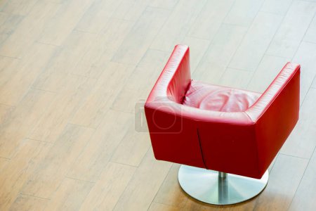 Photo for Fashion red armchair on a wooden floor - Royalty Free Image
