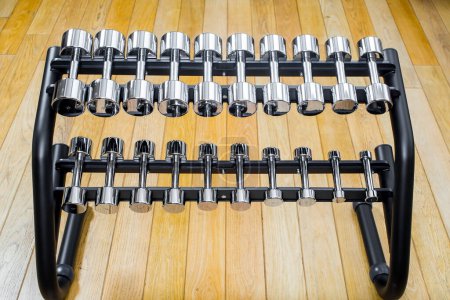 Photo for Dumbbells in modern sports club. Weight Training Equipment - Royalty Free Image